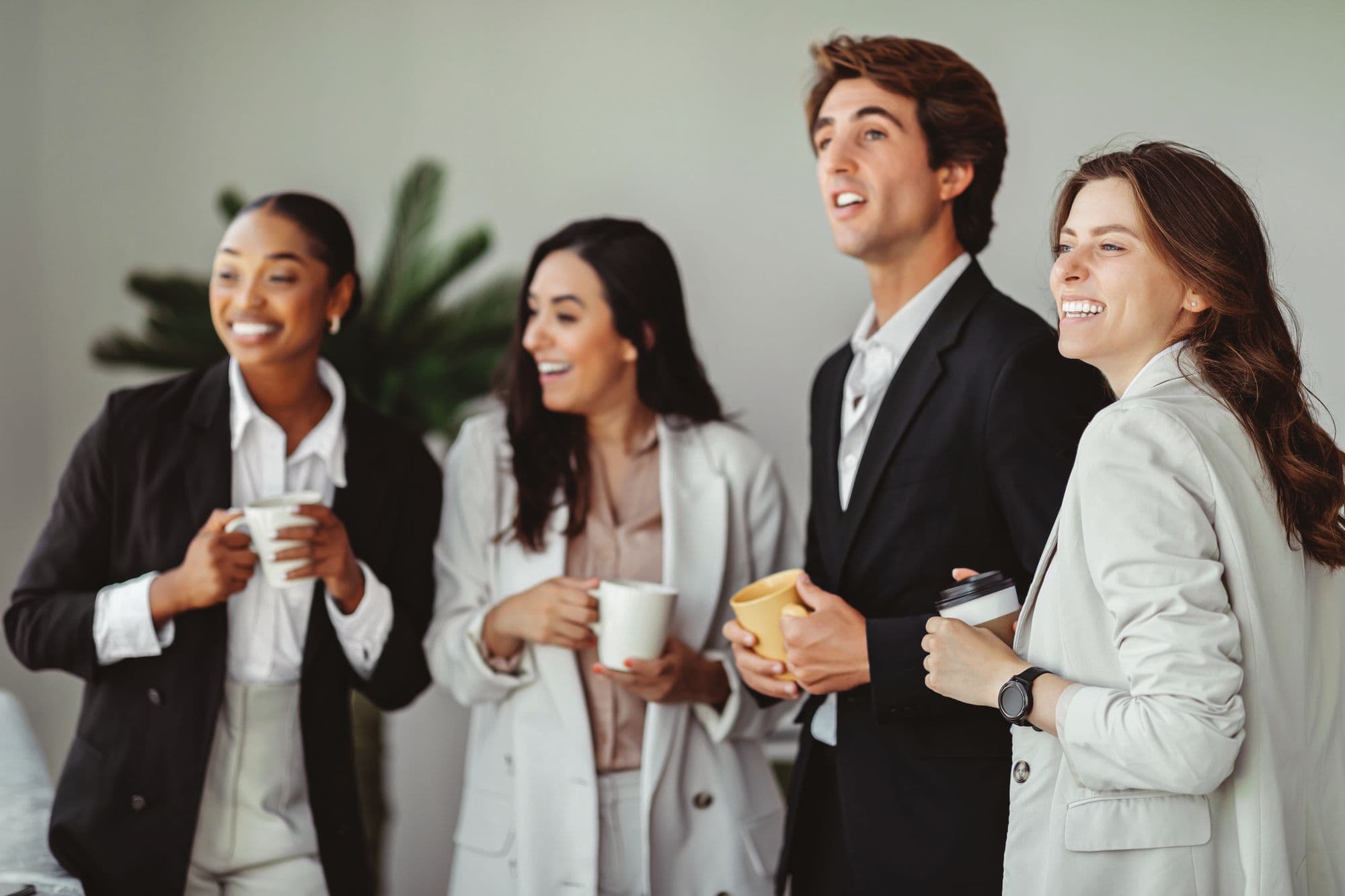 Hospitality professionals talking over coffee