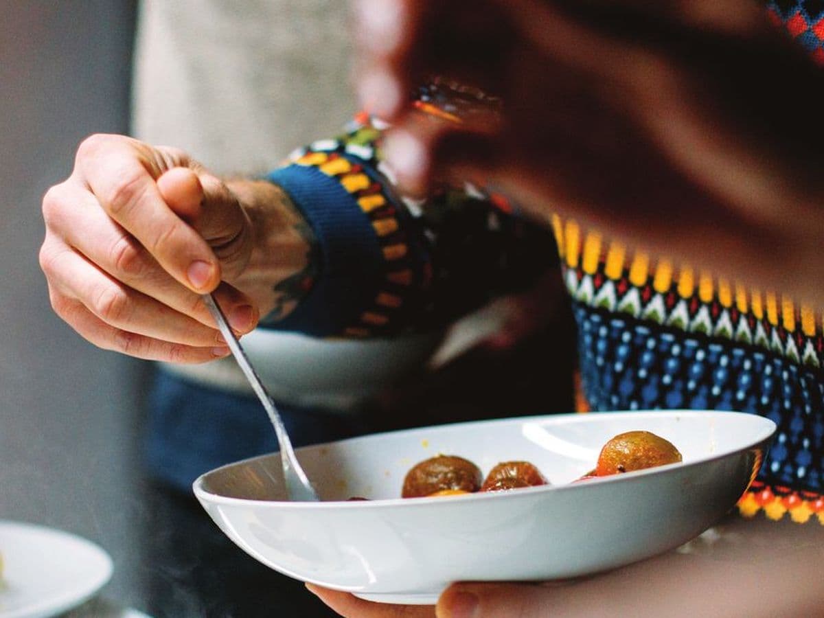 A chef plating food